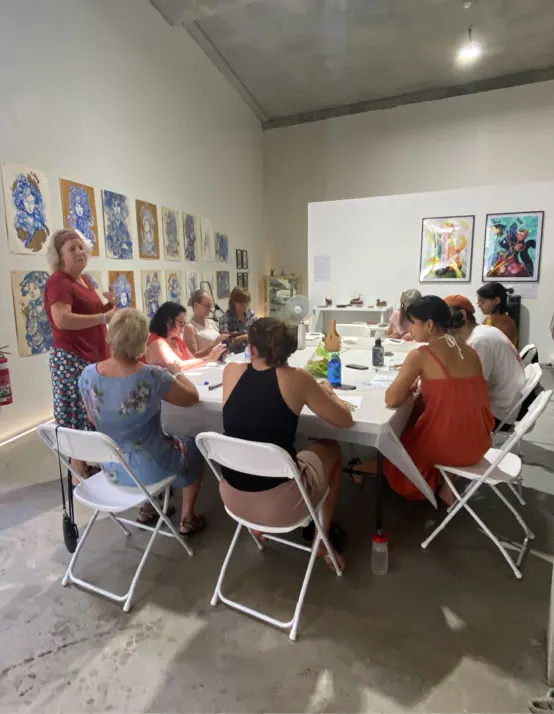 A jewellery-making workshop underway at a long table inside the exhibition